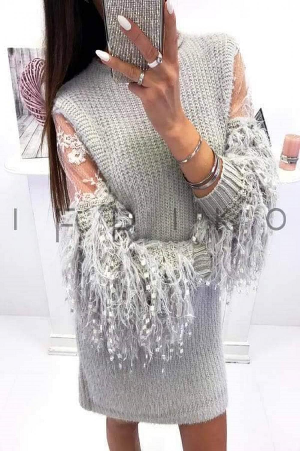 Knitted dress with impressive sleeves